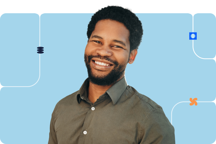 A person in a professional outfit in front of a blue background